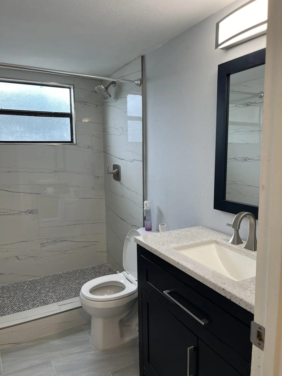 Renovated bathroom by Palm Beach Renovations