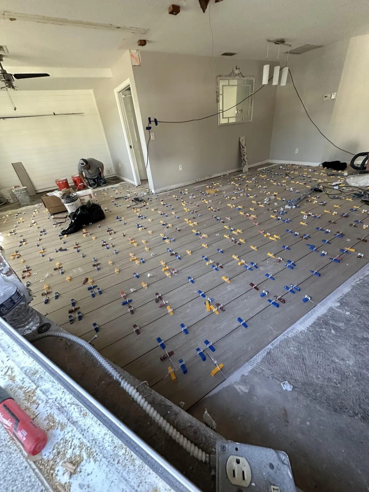 Tile flooring installation in progress by Palm Beach Renovations